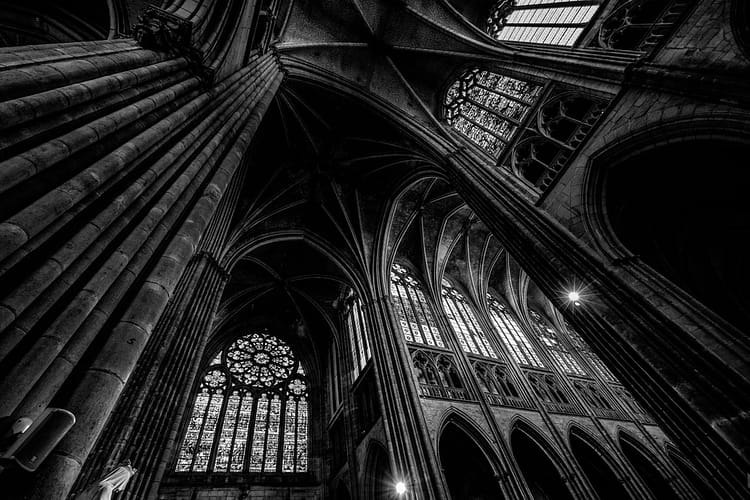 grayscale photography of cathedral ceiling